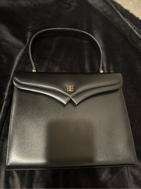 vintage Givenchy handbag featuring a structured black leather design